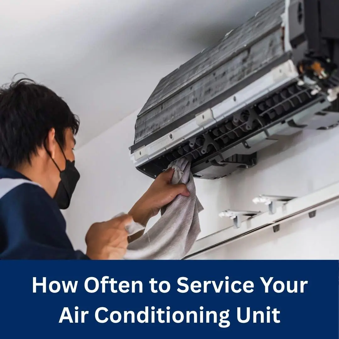How Often To Service Your Air Conditioning Unit 1 How Often To Service Your Air Conditioning Unit Technician inspecting an air conditioning unit during routine maintenance service